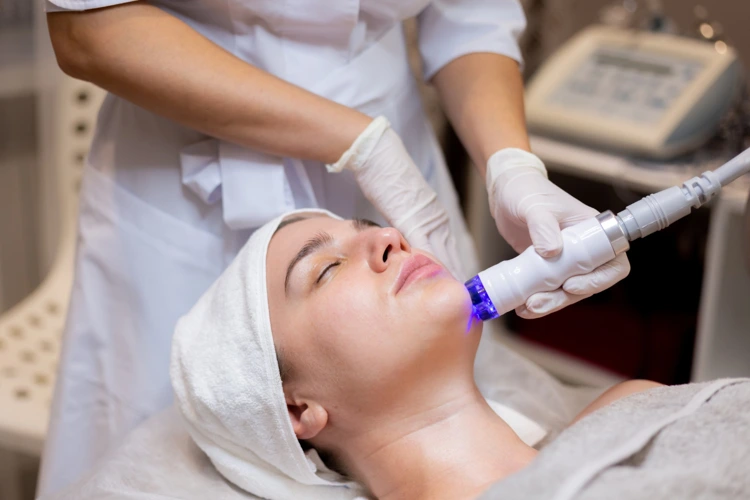 Lady undergoing Fractional CO2 Laser treatment at clinic.