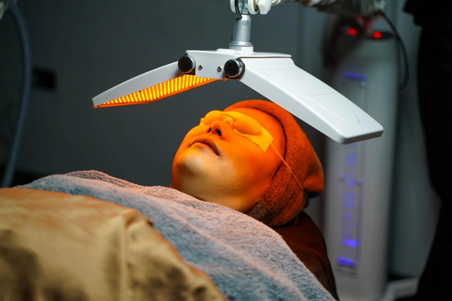 A lady undergoing LED Light treatment at clinic.