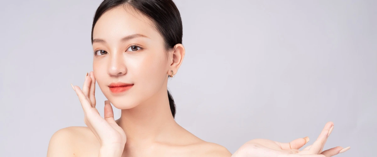 Lady with beautiful and flawless skin achieved through good skincare routine.