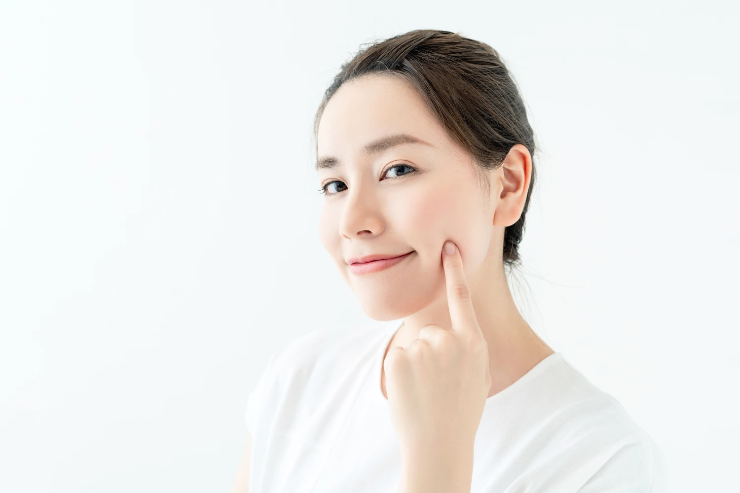 Lady with flawless-looking skin feeling happy after undergoing Minor Skin Surgery treatment.