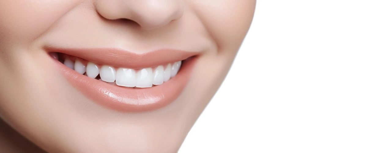 Confident lady flashing her wide smile and showing off her shiny and white set of teeth.